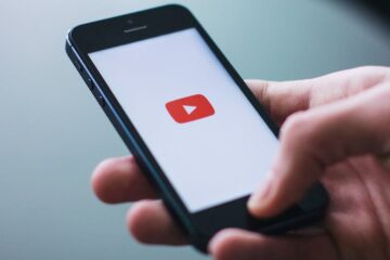 youtube on iphone in hand